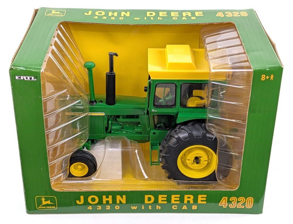 1/16 Ertl John Deere 4320 Tractor w/ Cab 2005 Plow City Farm Show Edition: 1/16 Ertl John Deere 4320 tractor with cab. 2005 Plow City Farm Toy Show Edition. Good condition in the box.