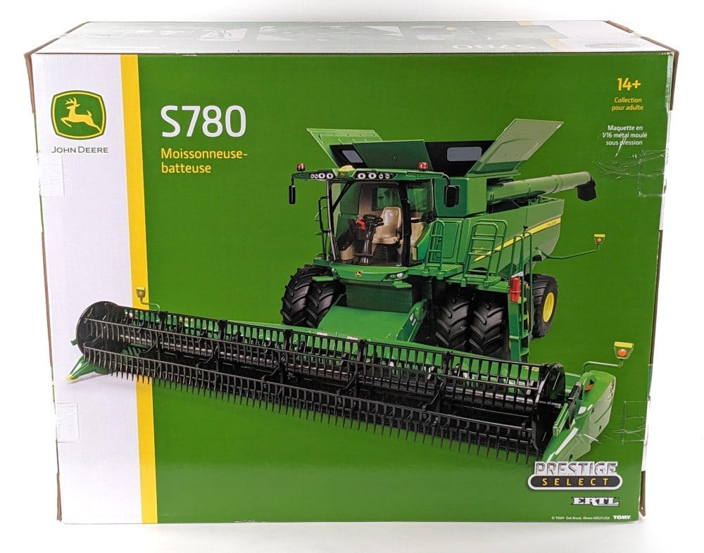 1/16 Ertl John Deere S780 Combine - Prestige Select Series: STOCK PHOTOS USED. 1/16 Ertl John Deere S780 combine. Part of the Prestige Select series. The combine is new in the box / the box has never been opened. A very large and heavy scaled replica.