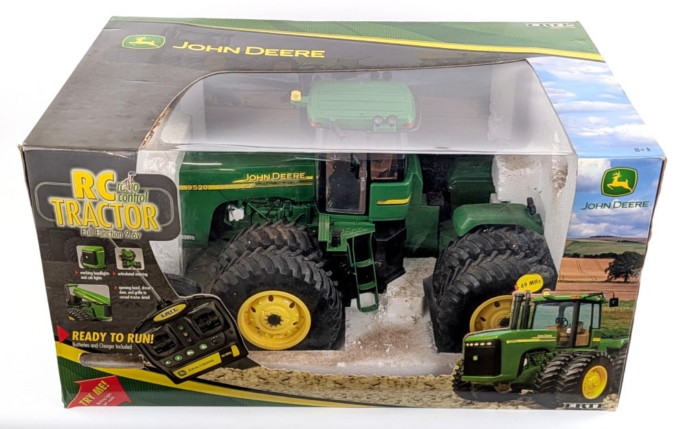 Ertl John Deere 9520 4wd Remote Control Tractor: Ertl John Deere 9520 4wd remote control tractor. Approximately 1/12 scale. The tractor is in the box, however the inside of the box and tractor are dirty. Appears to work as the remote has the tractor