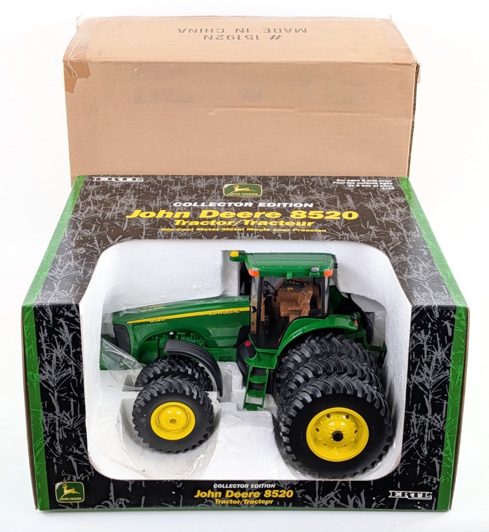 1/16 Ertl John Deere 8520 Tractor w/ Triples: 1/16 Ertl John Deere 8520 tractor with triples on the rear and duals on the front. Good condition new in the box with the cardboard shipping sleeve.