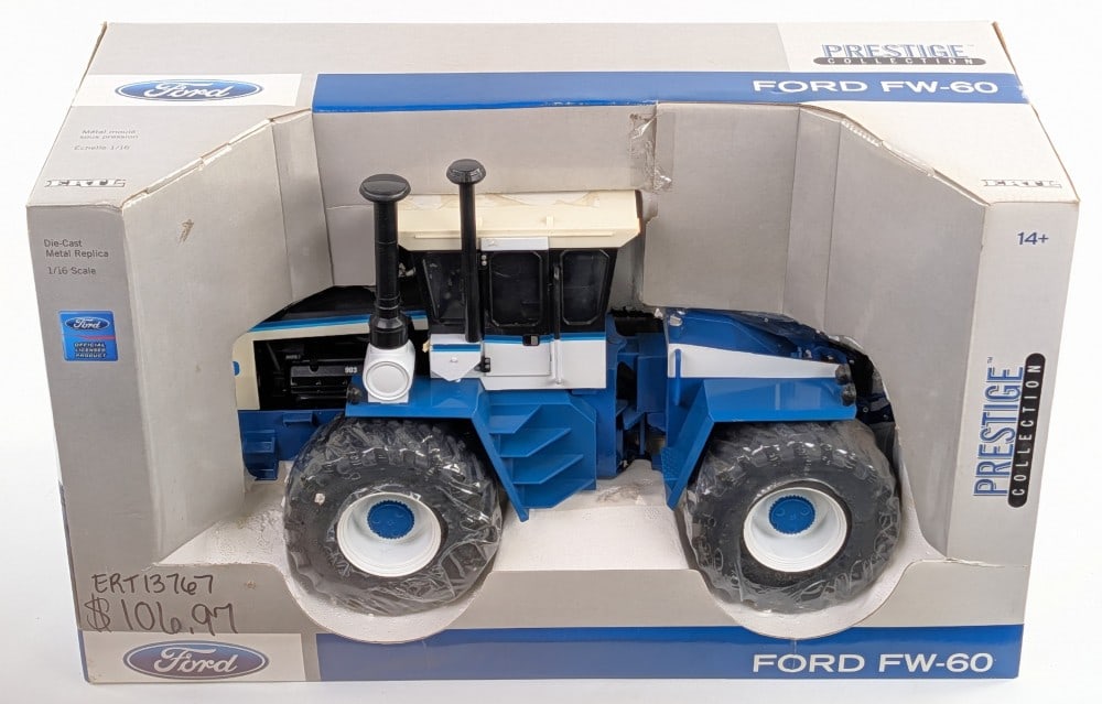 1/16 Ertl Ford FW-60 4wd Tractor Prestige Collection Series: 1/16 Ertl Ford FW-60 4wd tractor. Prestige Collection Series. The box has sharpie writing on the front. The box has never been opened. The tractor has some discoloration to the cab roof and a small te