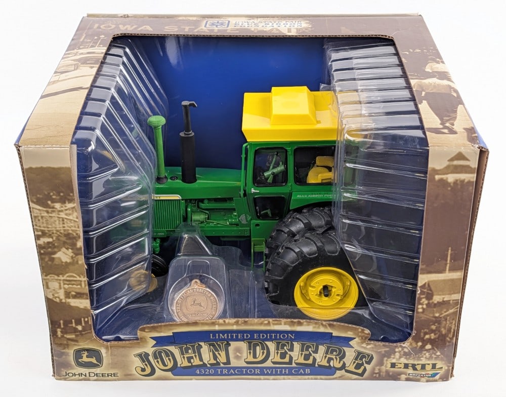 1/16 Ertl John Deere 4320 Tractor w/ Cab & Duals Iowa State Fair Edition: 1/16 Ertl John Deere 4320 tractor with cab. Iowa State Fair Blue Ribbon Foundation edition. Limited edition #116 of 3500. Good condition in the box with some dust from storage.