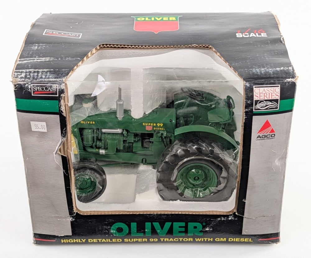 1/16 SpecCast Oliver Super 99 Tractor with GM Diesel Engine: 1/16 SpecCast Oliver Super 99 tractor with GM diesel engine. The tractor is in good condition new in the box. The box has wear from storage and handling.
