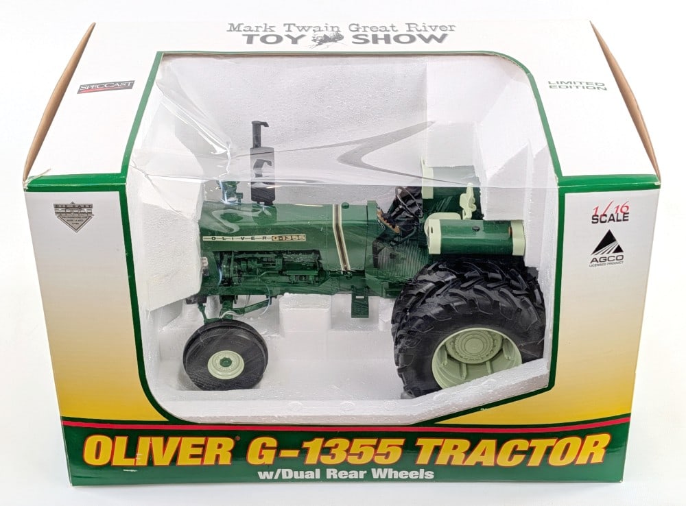 1/16 SpecCast Oliver G-1355 Tractor with Rear Duals: 1/16 SpecCast Oliver G-1355 tractor with rear duals. the tractor is in good condition new in the box. Mark Twain Great River Toy Show limited edition. The clear plastic box window has some crushing.