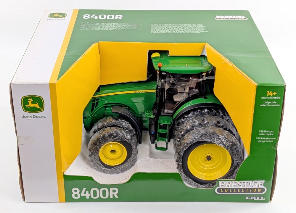 1/16 Ertl John Deere 8400R Tractor w/ Triples - Prestige Collection: 1/16 Ertl John Deere 8400R tractor with triples on the rear and duals on the front. Prestige Collection Series. Good condition new in the box.