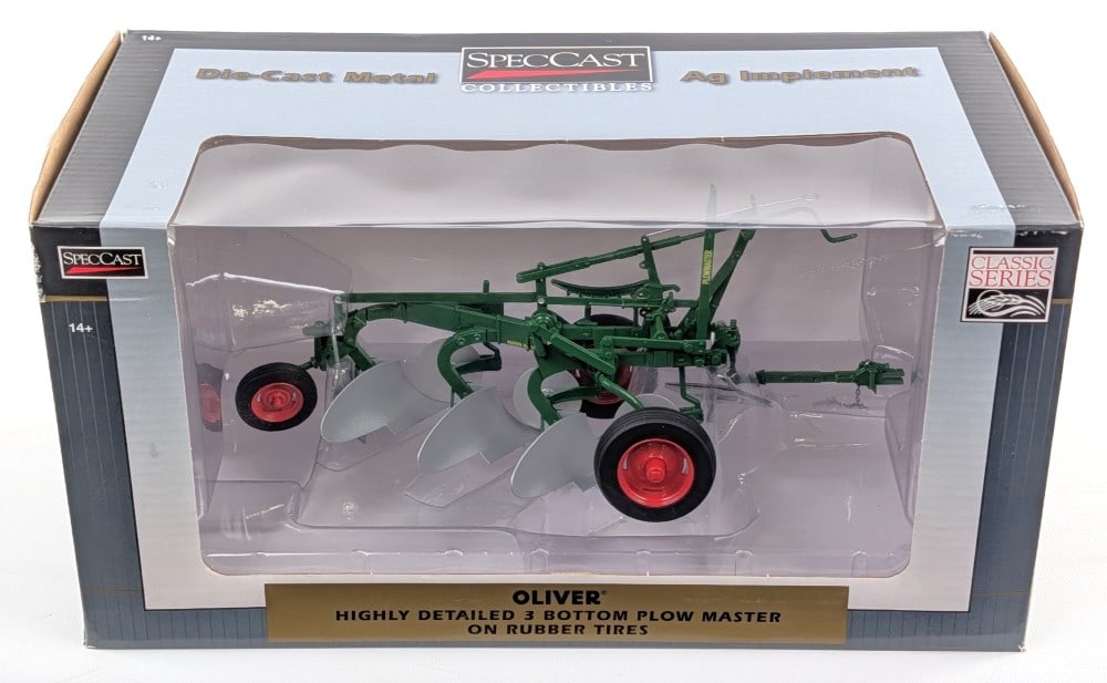 1/16 SpecCast Oliver 3-Bottom Plow on Rubber Tires: 1/16 SpecCast Oliver 3-bottom plow master on rubber tires. Good condition new in the box and highly detailed. The box shows minor wear from handling.