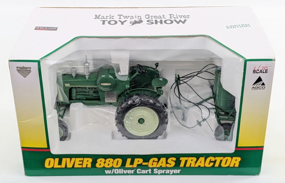 1/16 SpecCast Oliver 880 LP-Gas Tractor with Cart Sprayer: 1/16 SpecCast Oliver 880 LP-Gas tractor with Oliver cart sprayer. 2010 Mark Twain Great River Toy Show. Good condition new in the box and highly detailed.