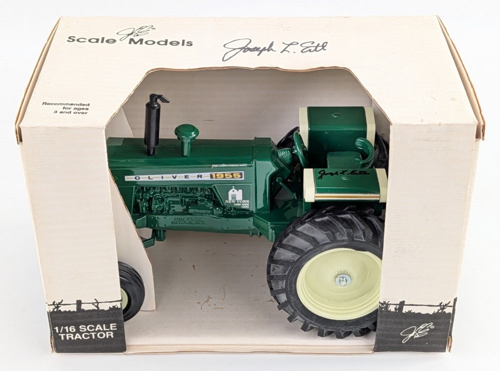 1/16 Scale Models Oliver 1955 Wide Front Tractor - Signed Joe Ertl: 1/16 Scale Models Oliver 1955 wide front tractor. 1992 New York Farm Show Edition. The top of the box and tractor fender are both signed by Joe Ertl. Good condition new in the box.