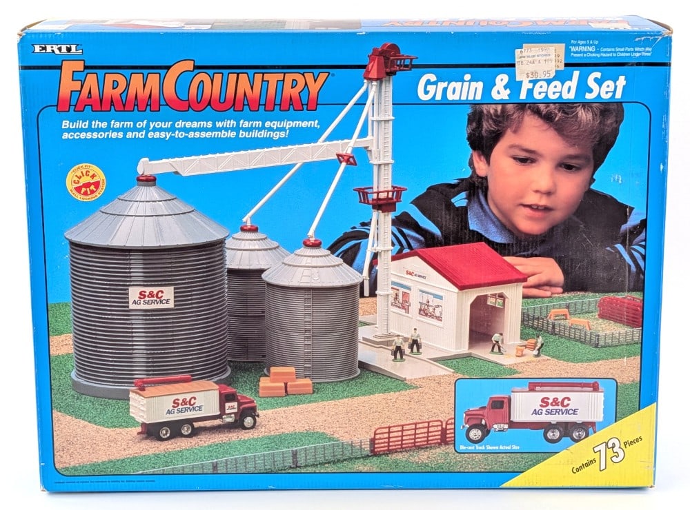 1/64 Ertl Farm Country S&C AG Service Grain & Feed Set - NIB: 1/64 Ertl Farm Country S&C AG Service grain and feed playset in the box. The set appears to be complete and the pieces are new in the plastic bags. It comes with the instructions manual. The box shows