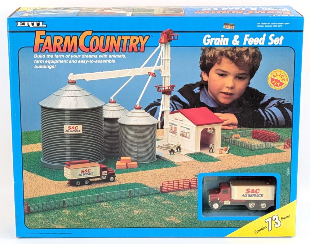 1/64 Ertl Farm Country Grain & Feed Set - Sealed: 1/64 Ertl Farm & Country grain and feed set. The set is still factory sealed in the original box. The box shows some minor wear from storage. Overall a great example and very hard to find still factor