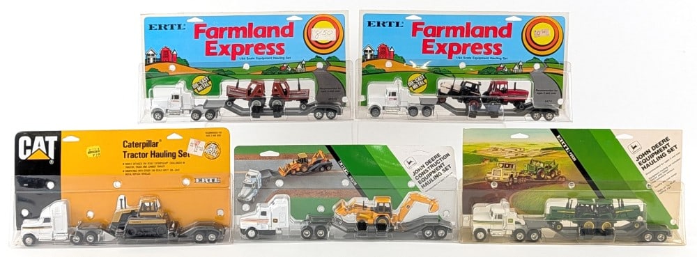 (5) 1/64 Ertl Semi Trucks with Loaded Lowboy Trailers: (5) 1/64 Ertl Semi Trucks with Loaded Lowboy Trailers. Includes Hesston, Caterpillar, (2) John Deere , and Case. Good condition in the packages.