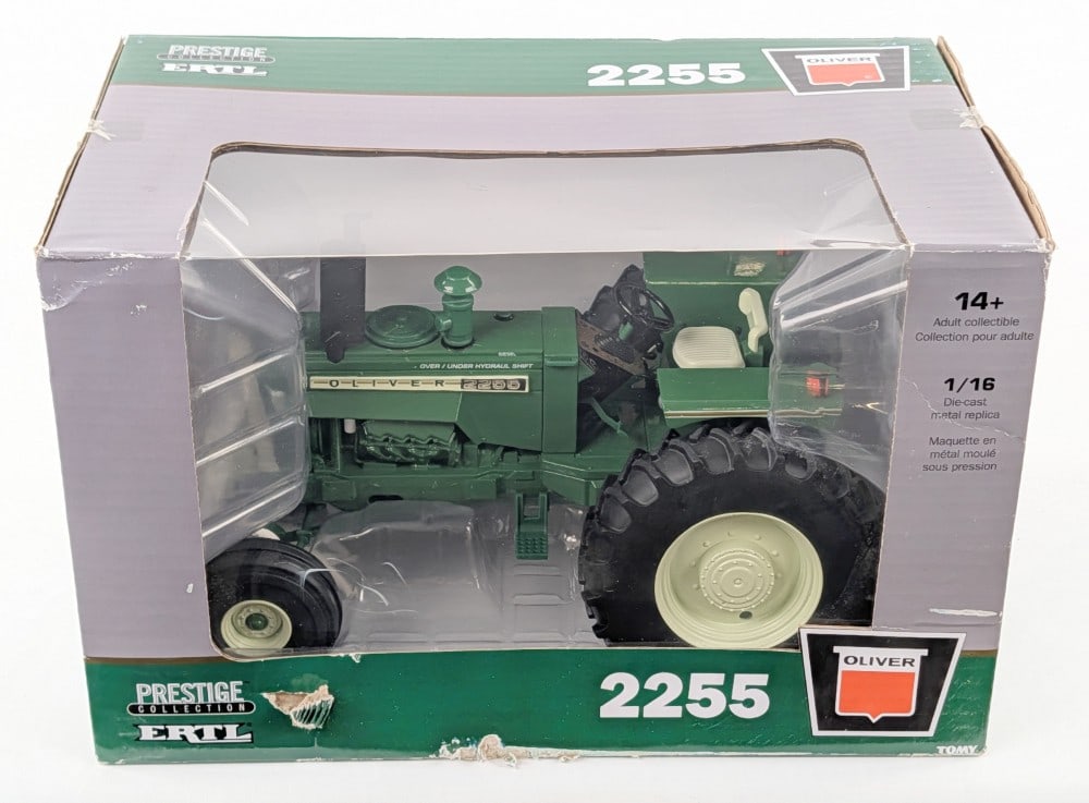 1/16 Ertl Oliver 2255 Tractor Prestige Collection Series: 1/16 Ertl Oliver 2255 tractor with wide front. Prestige Collection Series. The box has some wear and tear, but the tractor is in good condition.