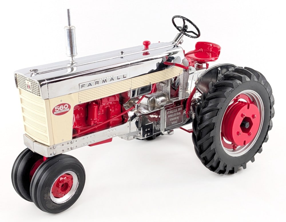 Custom Chrome 1/8 Scale Farmall 560 Narrow Front Tractor: Very nice custom chrome 1/8 scale Farmall 560 narrow front tractor. Displays well with custom wheel weights, tires, and a shiny chrome finish. Good condition. 1996 Collector's Edition marked on the fr