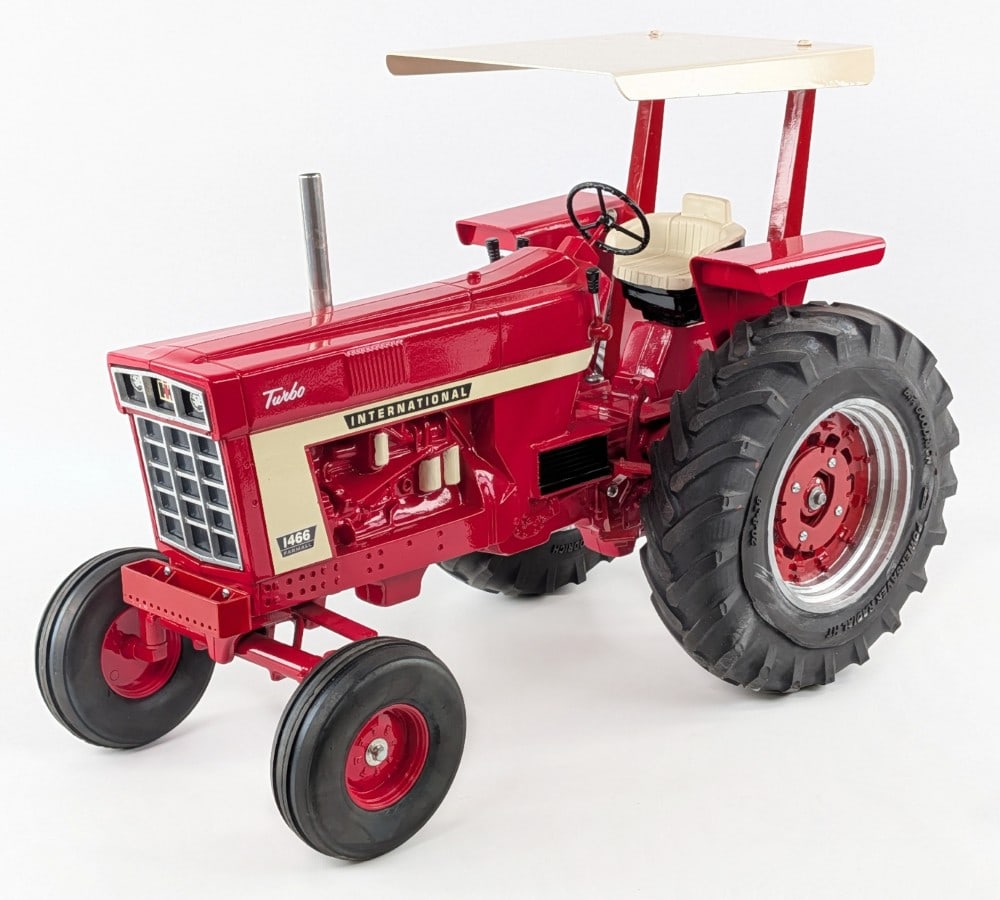 Custom 1/8 Scale International Farmall 1466 Tractor w/ Canopy: Custom 1/8 scale International Farmall 1466 wide front tractor with canopy. The tractor has custom tires, canopy, chrome stack, and levers. The canopy has some paint touchups and the rear wheels are a