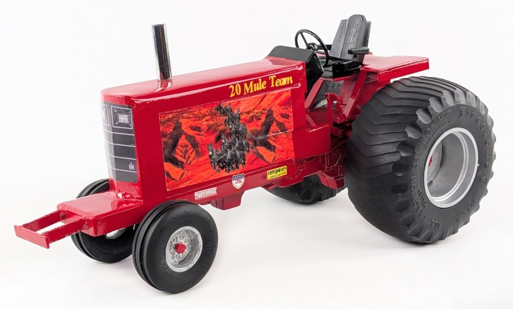 Custom 1/8 Scale International 20 Mule Team Pulling Tractor: Unique custom 1/8 scale International 20 Mule Team pulling tractor. The tractor has custom tires, custom decals, and chrome stack. Good condition and displays well.