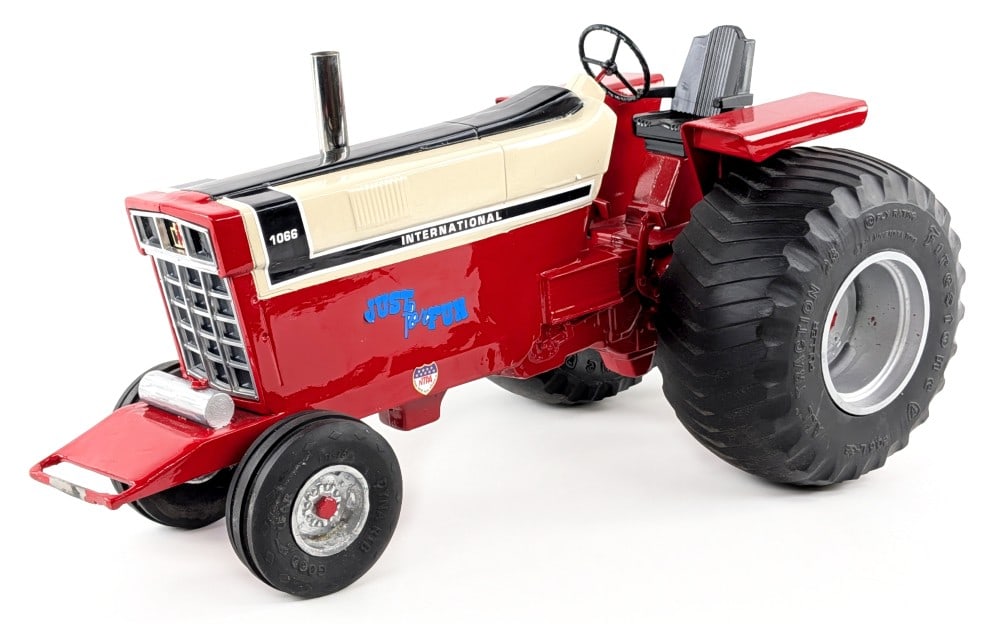 Custom 1/8 International 1066 "Just For Fun" Pulling Tractor: Custom 1/8 scale International 1066 pulling tractor. The tractor has custom tires, chrome stack and custom body work. It does have some paint loss on the front weight bar, but overall is in good condi