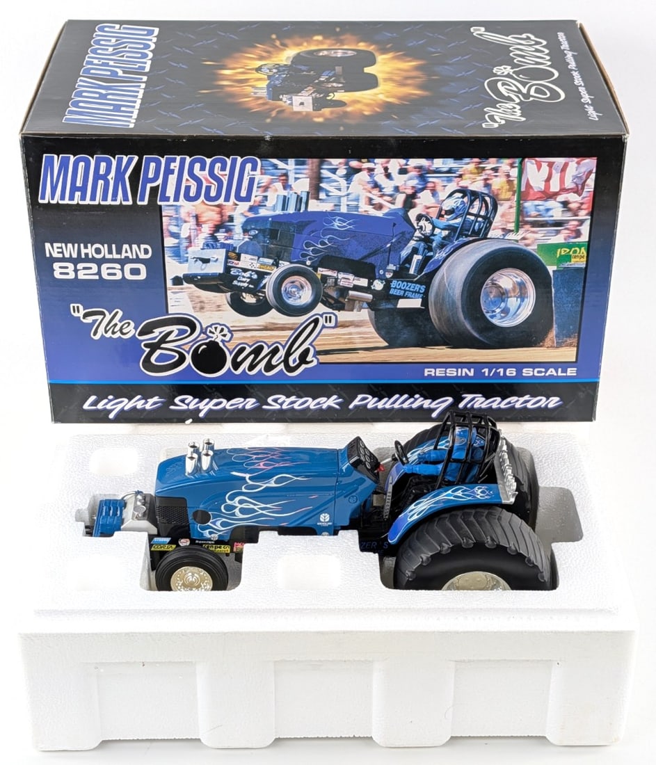 1/16 SpecCast Mark Peissig New Holland 8260 "The Bomb" Pulling Tractor: 1/16 SpecCast Mark Peissig New Holland 8260 "The Bomb" light super stock pulling tractor. A highly detailed resin replica. Good condition in the box.