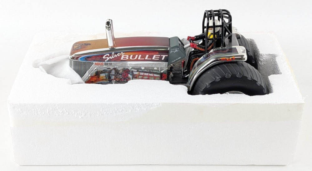 1/16 SpecCast AGCO 8810 Silver Bullet Pulling Tractor - Chrome: 1/16 SpecCast AGCO 8810 Silver Bullet pulling tractor in chrome. The tractor comes with the styrofoam, but no box. The tractor has crazing on the hood and fenders, but otherwise appears to be in good