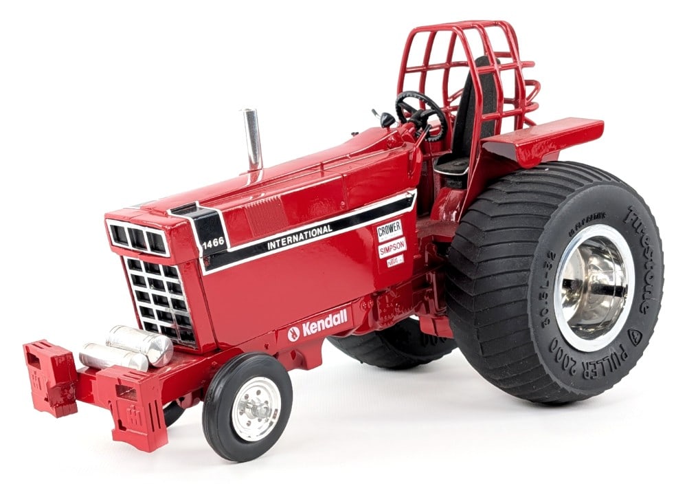 Custom 1/16 International 1466 Pulling Tractor: Custom 1/16 International 1466 pulling tractor. A nicely done highly detailed replica. The tractor displays well with custom tires, roll cage, exhaust stack, and suitcase weights. Good condition overa