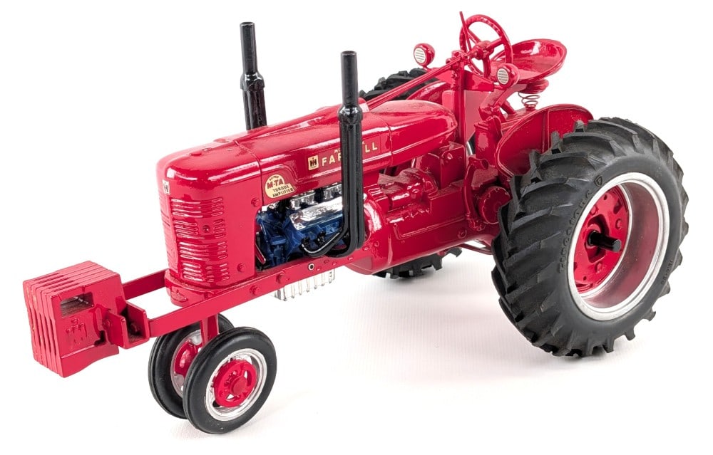 Custom 1/16 Farmall Super M-TA Pulling Tractor: Custom 1/16 Farmall Super M-TA pulling tractor. Displays well with conversion kit, suitcase weights, custom tires, and great detail overall. Good condition with light dust from storage and display.