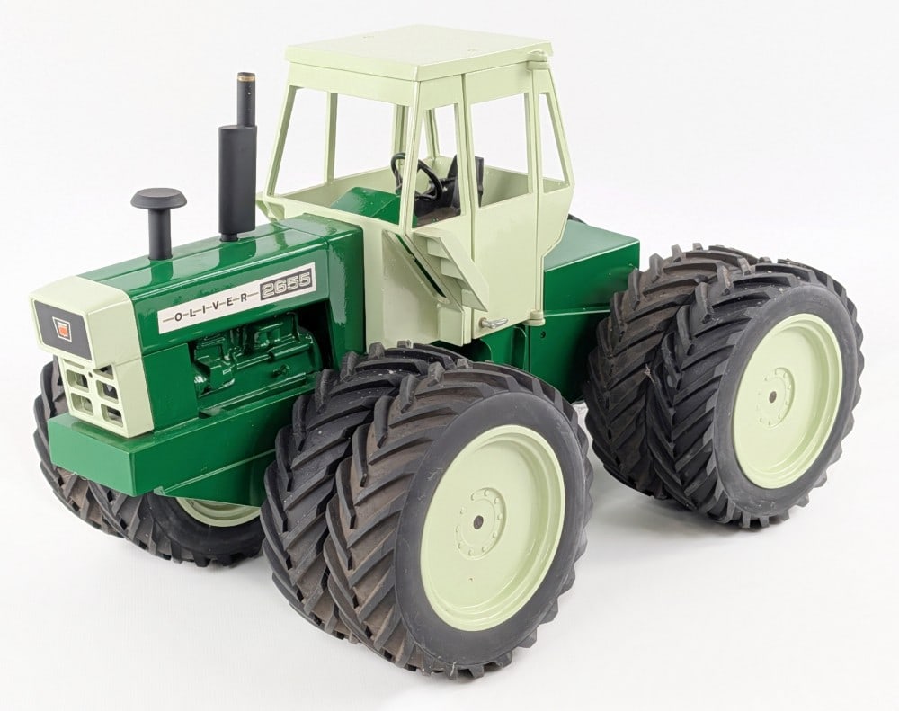 Custom Barrick 1/16 Oliver 2655 4wd Tractor: Harry Barrick custom 1/16 Oliver 2655 4wd tractor. The tractor displays well with 3-point hitch, door on the cab, custom tires, and good detail. A very well built and heavy custom replica. Good condit