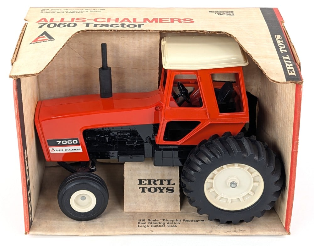 1/16 Ertl Allis-Chalmers 7060 Tractor w/ Cab: Vintage 1/16 Ertl Allis-Chalmers 7060 tractor with cab in the original box. The tractor has a tiny scratch on the hood above the decal. The box is overall very straight and clean with some minor creas