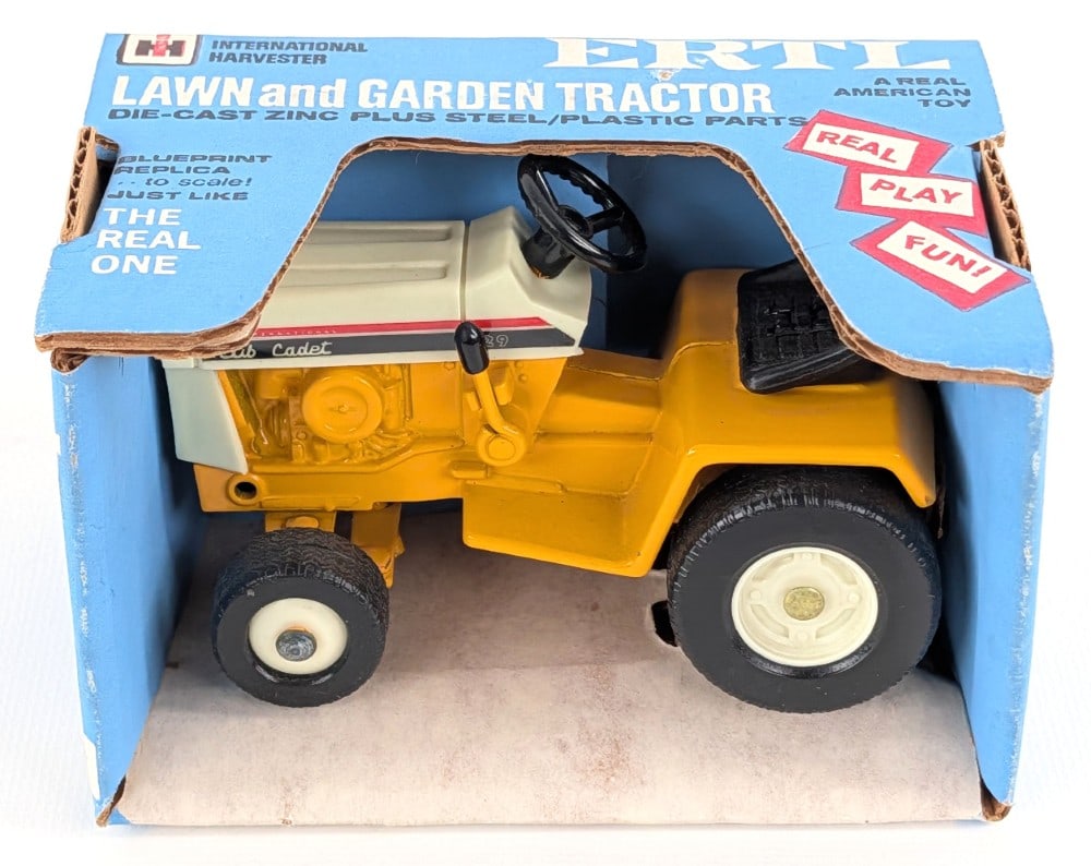 1/16 Ertl IH Cub Cadet 129 Lawn and Garden Tractor in Blue Box: Vintage 1/16 Ertl IH Cub Cade 129 lawn and garden tractor in the original blue box. The tractor and box are in excellent near mint condition. The box has a minor scratch on the top, but otherwise is e