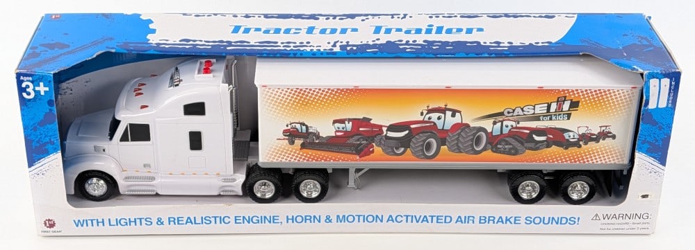 First Gear Case IH For Kids Semi Truck & Trailer: First Gear Case IH for Kids semi truck and trailer. The lights and sound are currently not working. The truck and trailer are new in the box. The box has some water damage.