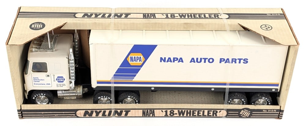 Nylint GMC Cabover NAPA Auto Parts Semi Truck and Trailer: Nylint GMC cabover NAPA auto parts 18-wheeler semi truck and trailer. The truck and trailer have some oxidation to the plastic chrome parts and light dust from storage. The box has some staining and w