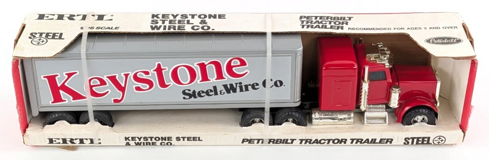 Ertl Peterbilt Keystone Steel & Wire Co. Semi Truck and Trailer: Ertl Peterbilt Keystone Steel & Wire Co. semi truck and trailer. The truck and trailer are in good condition. The box shows some staining and dust from storage / display.