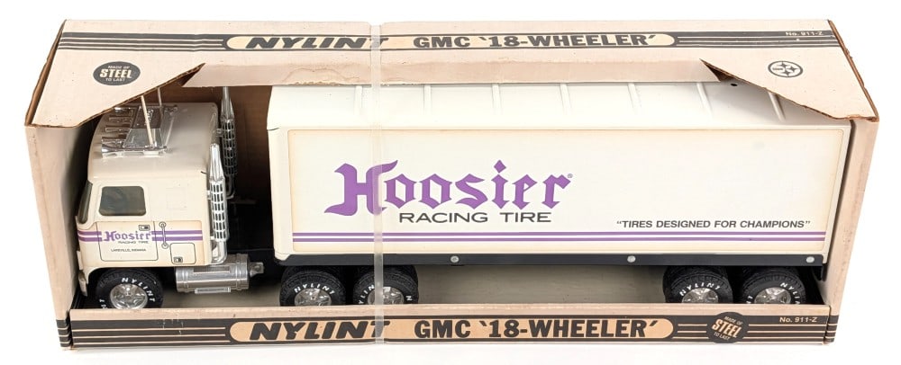 Nylint GMC 18-Wheeler Hoosier Racing Tire Semi Truck & Trailer: Nylint GMC 18-wheeler Hoosier Racing Tire semi truck and trailer. The truck has some minor discoloration to the decals. The box has some minor staining and light wear from storage.