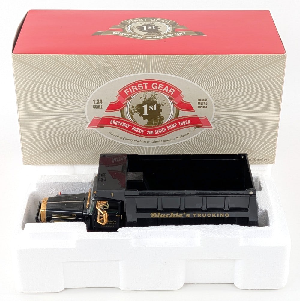 1/34 First Gear Brockway Huskie 200 Series Dump Truck: 1/34 First Gear Brockway Huskie 200 series dump truck. Blackie's Trucking edition. The truck has dust and light wear from display.