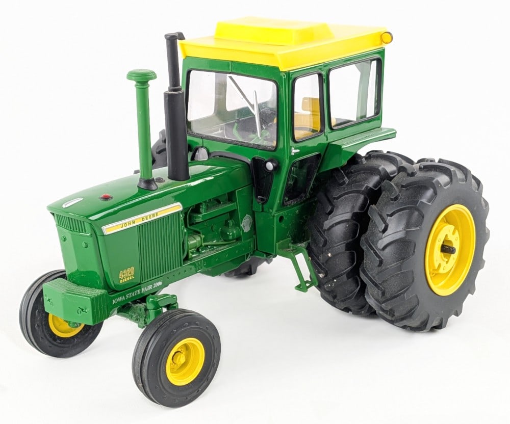 1/16 Ertl John Deere 4320 Diesel Tractor w/ Duals: 1/16 Ertl John Deere 4320 diesel tractor with cab and duals. 2006 Iowa State Fair edition. Limited edition #2248 of 3500. The tractor has some dust and light wear from display.