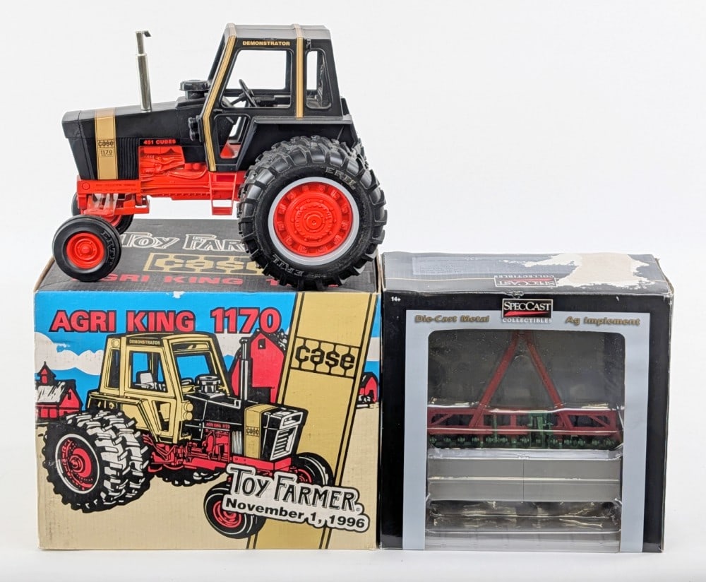 1/16 Ertl Case 1170 Golden Demonstrator and Case Model "D" Grain Drill: 1/16 Ertl Case 1170 Golden Demonstrator tractor (1996 Toy Farmer Edition) and 1/16 SpecCast Case Model "D" grain drill without grass seed hopper. The box for the grain drill has some moisture damage a