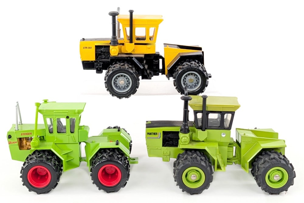 1/32 Ertl Steiger Panther, Steiger STR-360 and Steiger Super Wildcat Tractors: 1/32 Ertl Steiger Panther, Steiger STR-360 and Steiger Super Wildcat 4wd tractors. The tractors show dust and wear from storage and handling.