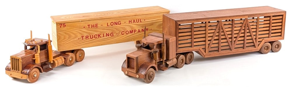 (2) Custom Wood Semi Trucks: (2) Custom wood semi trucks. Includes a truck with livestock trailer and a truck with van trailer. The one truck has loose mud flaps and is missing a mirror. The livestock truck measures approximately