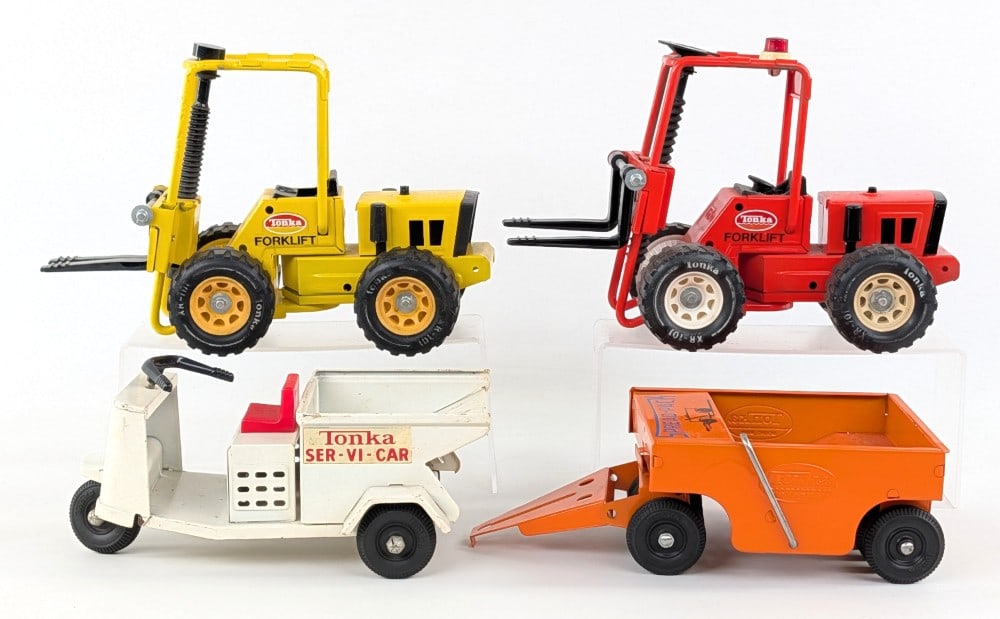 Tonka Forklifts, Spread-Pack, and Ser-Vi-Car: Includes restored Tonka forklifts, restored spread-pack, and original Tonka Ser-Vi-Car. The toys have amateur restorations. The Ser-Vi-Car is original with paint loss and play wear.