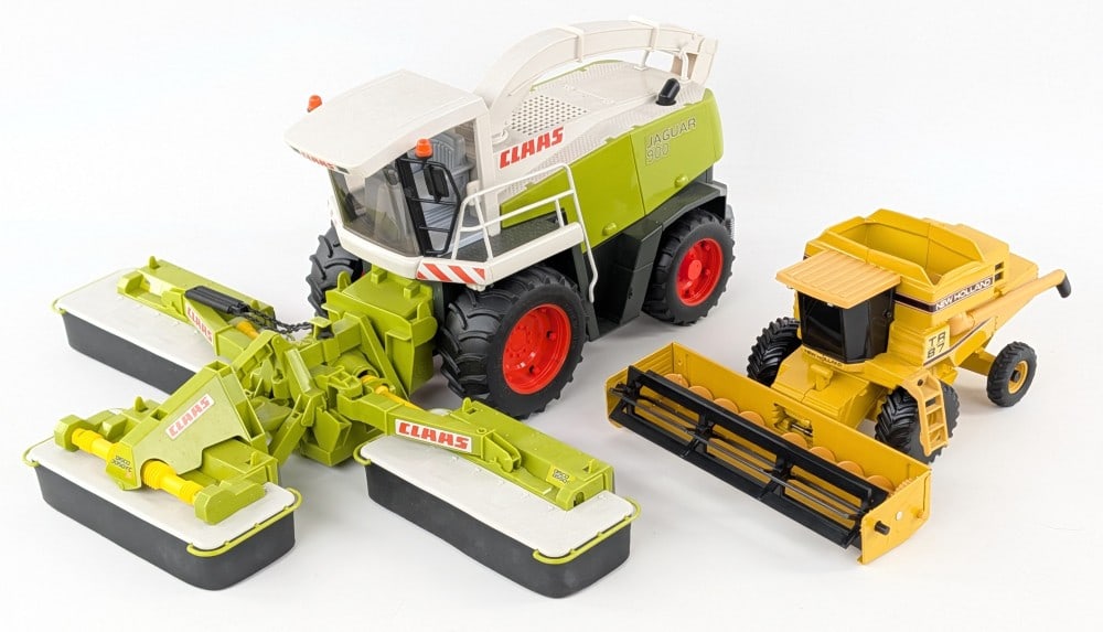 Bruder Jaguar 900 Field Chopper and 1/32 Ertl New Holland Combine: 1/16 Bruder Jaguar 900 field chopper and 1/32 Ertl New Holland combine with grain head. Both have dust and wear from display.