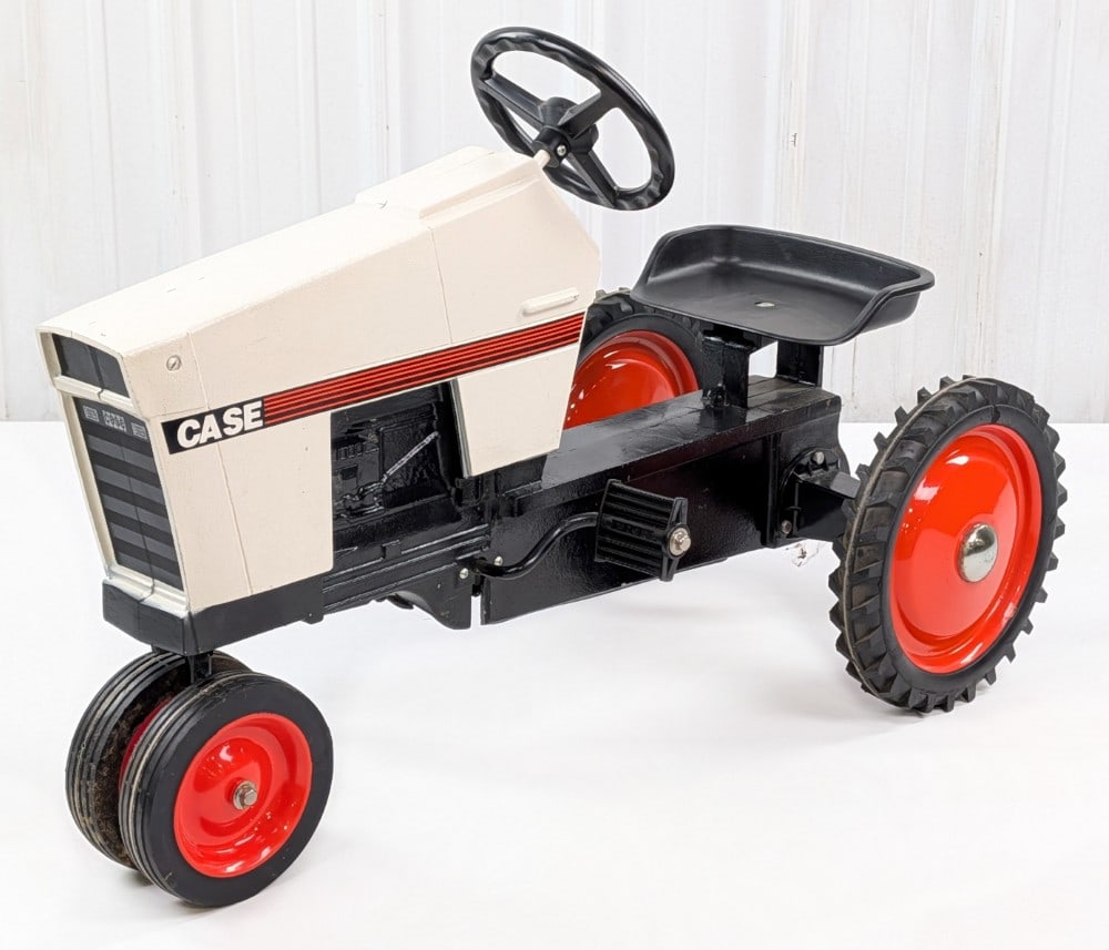 Restored Ertl Case White and Black '94 Series Pedal Tractor: Restored Ertl Case "white and black" '94 series narrow front pedal tractor. The tractor has an older restoration with some scuff marks, scratches, and light wear from storage and handling. Measures ap