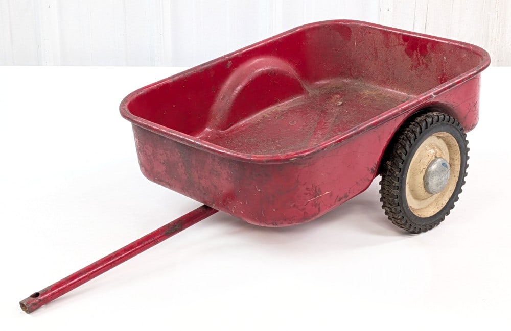 Eska / Ertl International Harvester Pedal Tractor Trailer: Eska / Ertl International Harvester pedal tractor trailer / wagon. The wagon has paint loss, surface rust, and wear from use and age. Measures approximately 30" long.