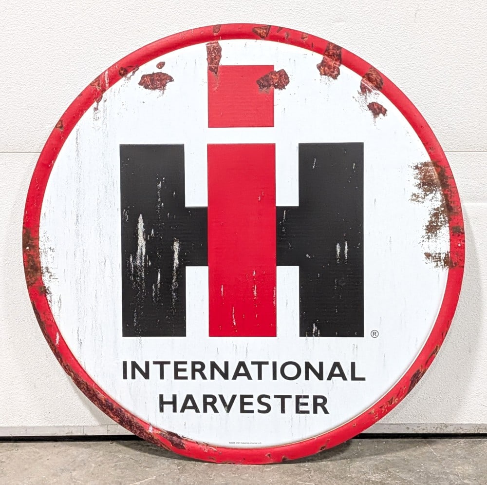 Single Sided Metal International Harvester Sign w/ Faux Patina: Single sided metal International Harvester advertising sign with faux patina. The sign has printed on faux patina / age. Measures approximately 36" in diameter.