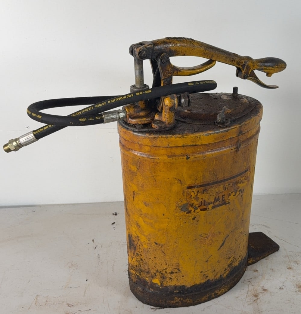 Alemite Tractor Volume Pump: New hose, painted Caterpillar yellow