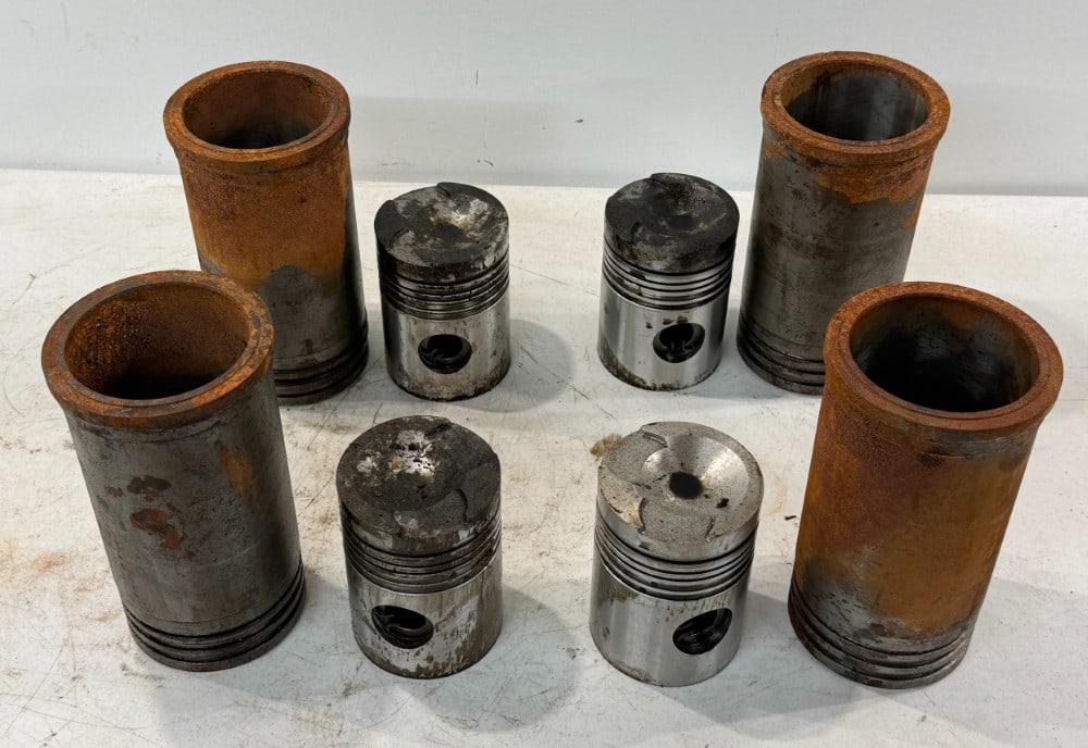 Caterpillar D2 New Sleeves and Pistons: Complete set found in box sitting on a D2. Box had mouse nest in it which caused rust. Believed they are D2 and can be cleaned and used