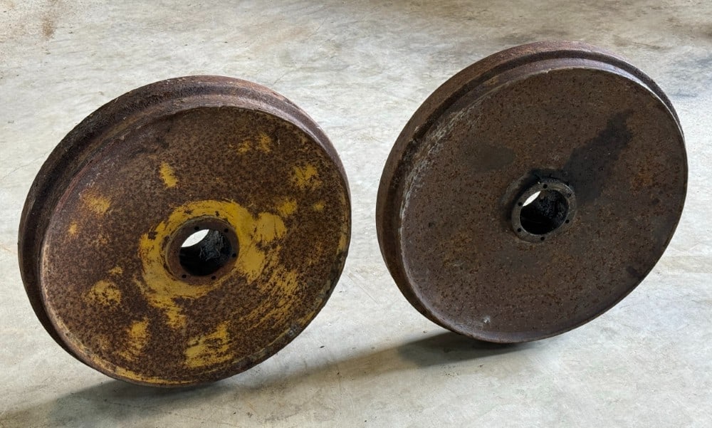 Caterpillar Front Idlers: Believed to be for Traxcavator or similar