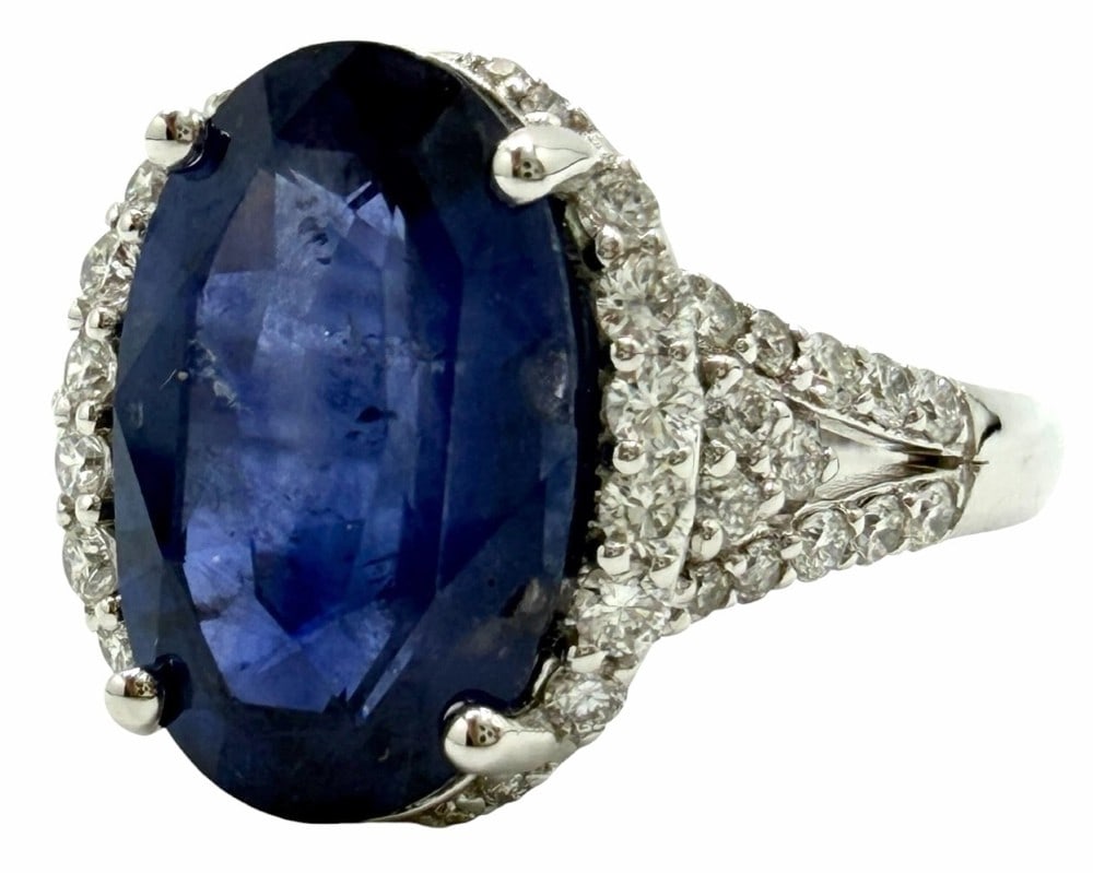 Platinum 5.65ctw Natural Sri Lanka Blue Sapphire and Diamond Ring, Size 6.5: Platinum 5.65ctw Natural Sri Lanka Blue Sapphire Corundum and Diamond Ring, Size 6.5.? This ring has an oval modified brilliant cut natural sri lanka blue sapphire corundum gemstone mounted in the cen