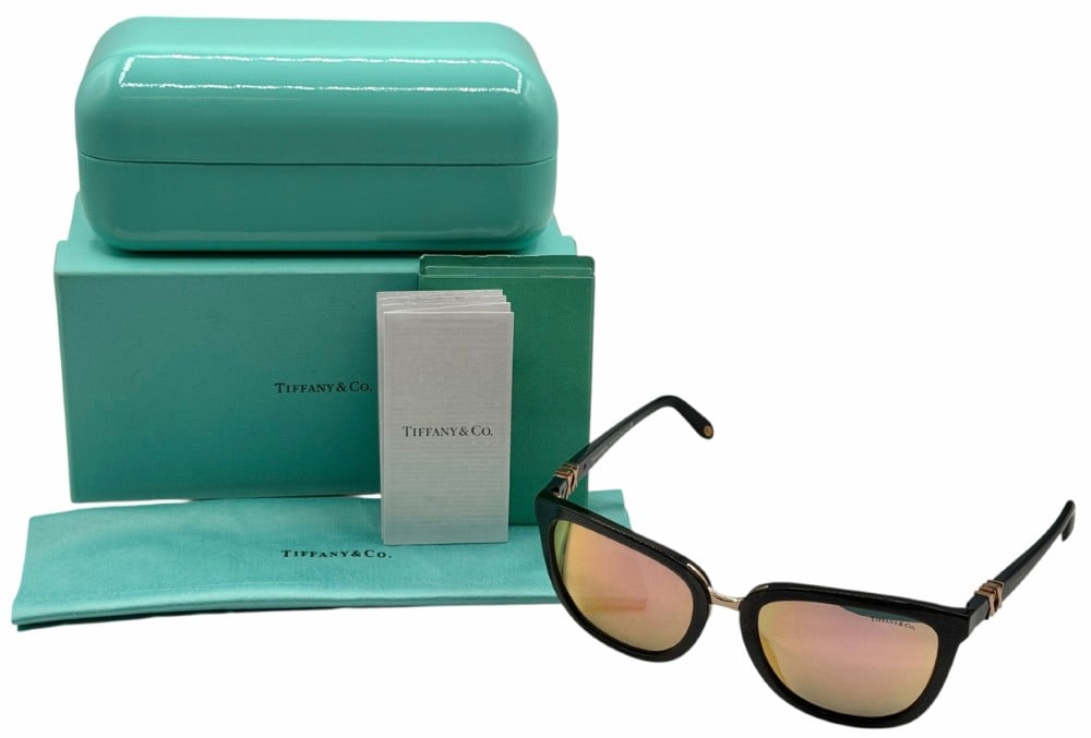 Tiffany & Co. TF4123 8211/4Z Italy Sunglasses With Case & Original Box: Tiffany & Co. TF4123 8211/4Z Italy Sunglasses With Case & Original Box. This beautiful pair of sunglasses feature a dark glittery frame with reflective lenses. It is marked Tiffany & Co on both the le
