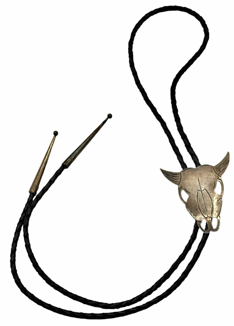 Vintage Manygoats Sterling Silver Native American Navajo Bull Head Bolo Tie: Vintage Manygoats Sterling Silver Native American Navajo Bull Head Bolo Tie, the slide is marked STERLING Many Goats and measures 2in x 2.25in.? Made with braided leather and finished off with sterlin