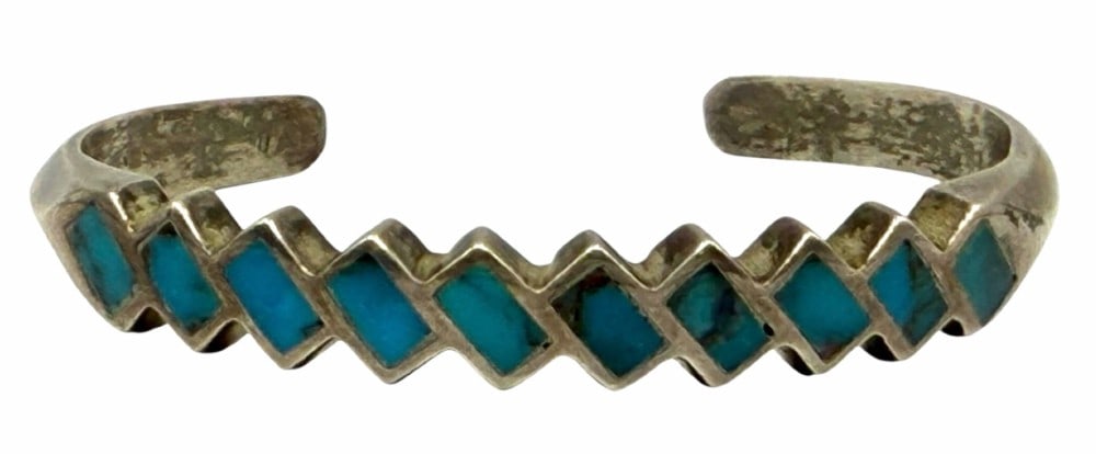 Old Trade Native American Navajo Turquoise Inlay Cuff Bracelet: Old Trade Native American Navajo Turquoise Inlay Cuff Bracelet. This beautiful piece is unmarked and measures 2 3/8in x 1 3/4in with a 1in opening. It weighs 21.1 grams.