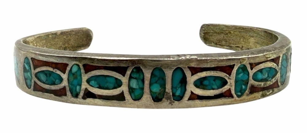 Old Trade Native American Navajo Inlaid Turquoise And Red Coral Cuff Bracelet: Old Trade Native American Navajo Inlaid Turquoise And Red Coral Cuff Bracelet . This unique piece is unmarked and measures 2.25in x 1.5in with a 1in opening and weighs 20 grams.