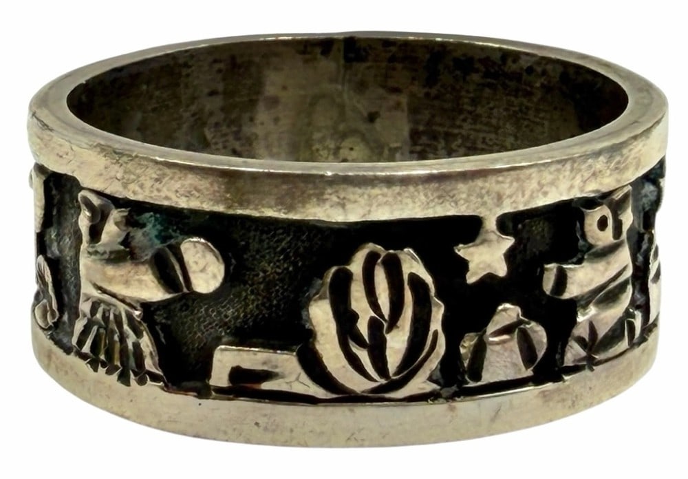 Lloyd Becenti Sterling Silver Native American Navajo Storyteller Ring: Lloyd Becenti Sterling Silver Native American Navajo Storyteller Ring. This beautiful size 11 band is engraved LLBCT STERLING and has intricate storytelling designs along the sides of the ring. Weighs